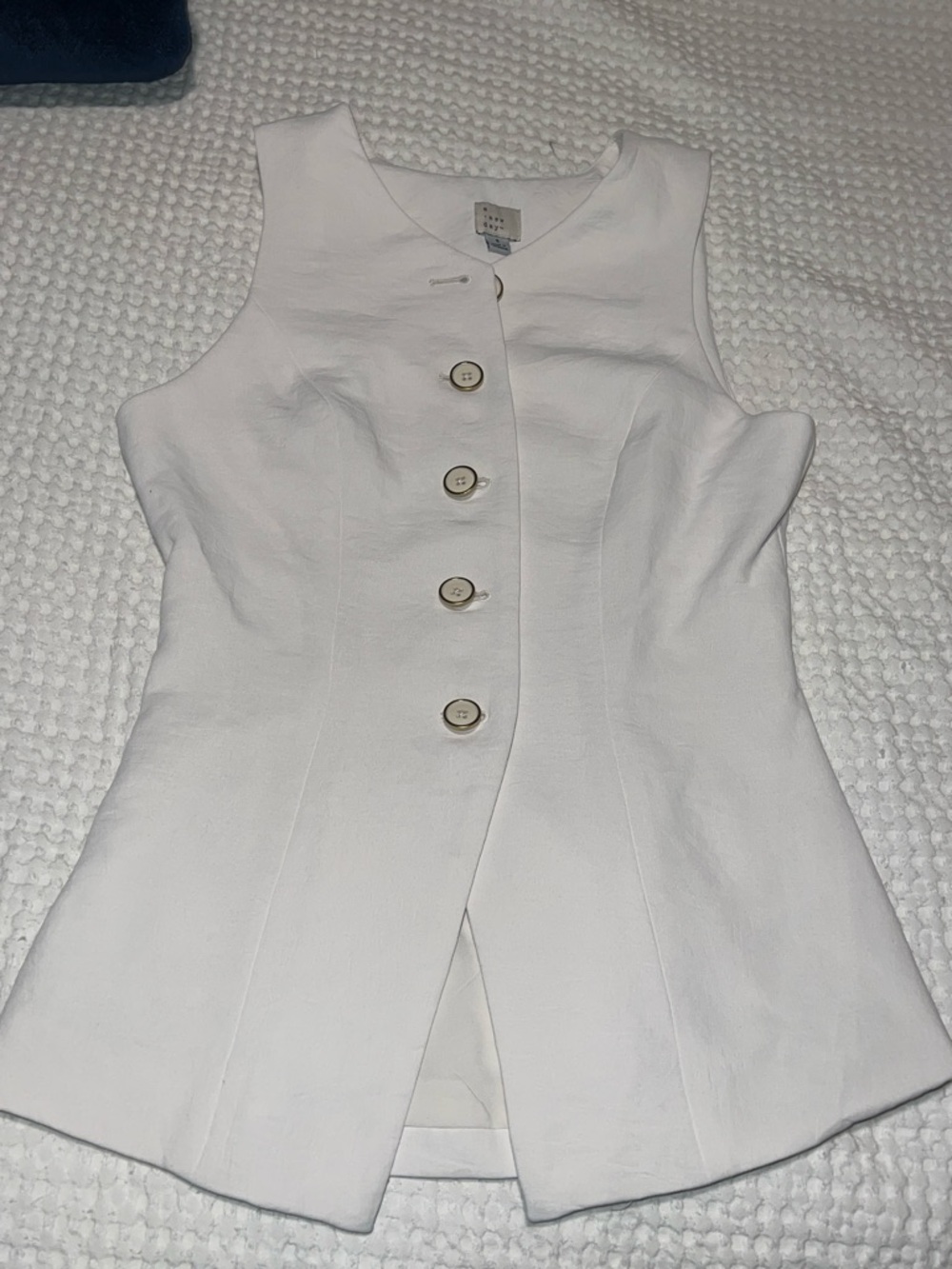 A new day cream/beige vest